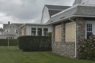 Homes along the Connecticut USA shoreline with windows boarded up for protection against Hurricane