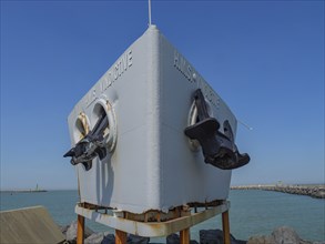 Large anchor at the bow of a ship off the coast under a clear sky, oostende, Belgium, Europe