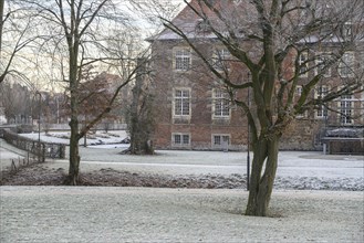 Winter scene with trees and a historic building in the background, Velen, North Rhine-Westphalia,