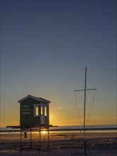 Minimalist beach hut at Westbad on the beach at sunset, langeoog, germany