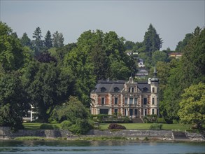 Magnificent villa with manicured garden surrounded by trees on the lakeshore, Lindau, Lake