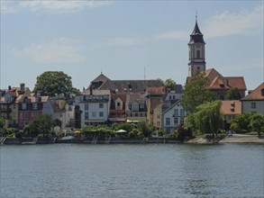 Picturesque town on the lake with colourful houses and a church on the shore, Lindau, Lake