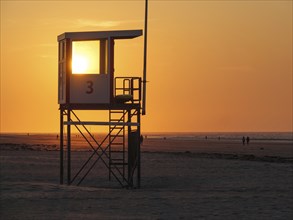 Close-up of a watchtower at sunset on the beach, warm light, juist, east frisia, germany