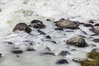 Dark boulders in a glacial stream, near Grimentz, Val d'Anniviers, Valais Alps, Canton Valais,