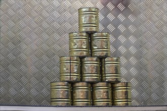 Stacked tin cans for a throwing game at a carnival funfair or Christmas market, copy space,