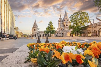 Old historic fortress and church at sunrise. City panorama at dusk. View of the Danube Fishermen's