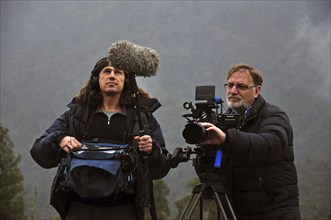 Cameraman and sound technician at work on the West Coast, New Zealand, Oceania