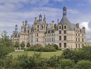 Chateau de Chambord a majestic medieval castle with green gardens. Beautiful palace in the region