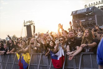 Festival-goers in the front row give the devil's salute at the Wacken Open Air in Wacken. The