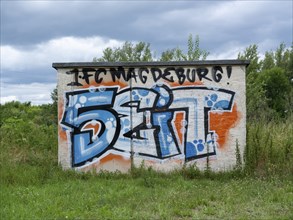 Graffiti 1. FC Magdeburg since 1965 on a wall at Jersleber See. In the European Cup, 1. FC