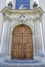 Artfully decorated wooden portal of the collegiate church, St. Gallen Cathedral, UNESCO World