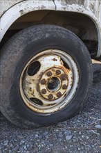 Close-up of black rubber tire with low air pressure on light truck, Quebec, Canada, North America