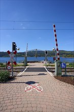 Railway crossing at Schluchsee and blue sky, embedded in a mountain landscape, Schluchsee, Black