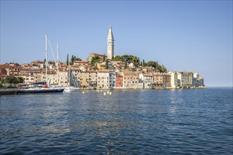 Old historic dreamy town on a beautiful island. Panorama of a romantic tourist town on a coast.