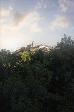 Fantastic sunset on a mountain. Great panorama of a mountain village on the Mediterranean.