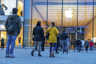 Shopping street, queues in front of the Apple Store, due to limited capacity of customers in the