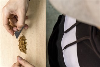 Hands preparing marijuana on the table