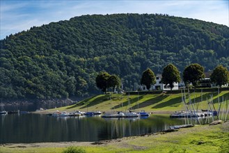 Small marina, jetty, sailing boats, view of the Rursee, Eifel National Park, North