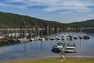 Small marina, jetty, sailing boats, view of the Rursee, Eifel National Park, North