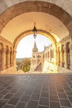 Old historic fortress and church at sunrise. City panorama at dusk. View of the Danube Fishermen's