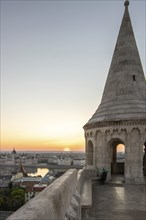 Old historic fortress and church at sunrise. City panorama at dusk. View of the Danube Fishermen's