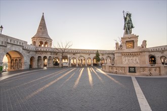 Old historic fortress and church at sunrise. City panorama at dusk. View of the Danube Fishermen's