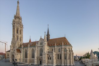 Old historic fortress and church at sunrise. City panorama at dusk. View of the Danube Fishermen's