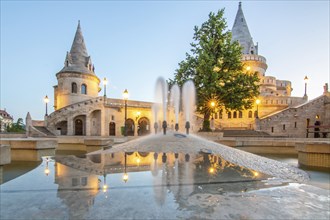 Old historic fortress and church at sunrise. City panorama at dusk. View of the Danube Fishermen's