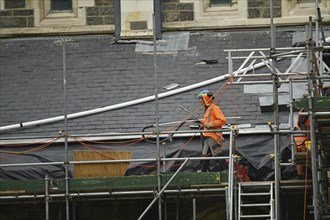 CHRISTCHURCH, NEW ZEALAND, FEBRUARY 24, 2022: A team of tradesmen work on the Anglican Cathedral