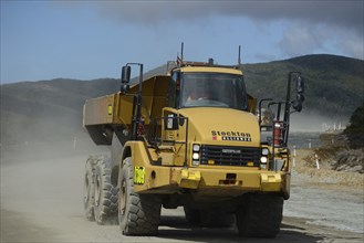 WESTPORT, NEW ZEALAND, MARCH 11, 2015: A truck carries a 90 ton load of coal at an open cast coal