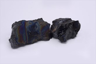 Pieces of anthracite from a New Zealand mine, known to the miners as rainbow coal or peacock coal.