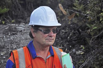 Portrait of a geologist inspecting a seismic line in New Zealand