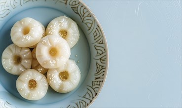 Korean steamed rice cakes (tteok) on a light blue background AI generated