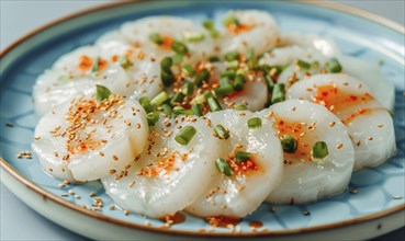 Korean steamed rice cakes (tteok) on a light blue background AI generated