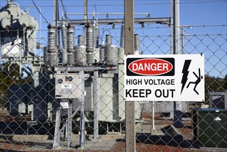 Signage warns people against accessing an electrical sub-station