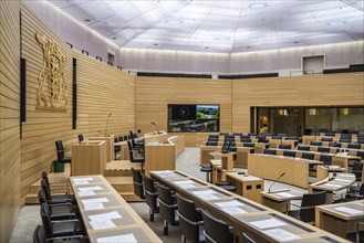 State parliament of Baden-Württemberg, assembly hall with state coat of arms. The seats of the