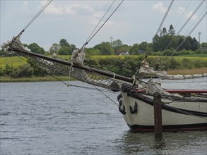 Close-up of the mast of a sailing boat against a calm natural backdrop, Kappeln,