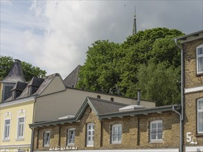 Building with roof and tree in the background under cloudy sky, Kappeln, SChleswig-Holstein,