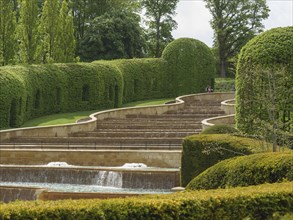 Beautifully landscaped garden with waterfall, steps and manicured hedges, Newcastle, England,