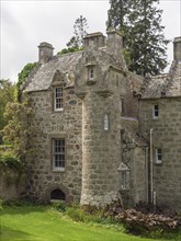 Part of an old castle with towers and stone walls, surrounded by trees, inverness, Scotland, Great