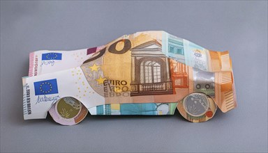 Symbol photo, a car, sports car, built from European banknotes, euro, AI generated, AI generated