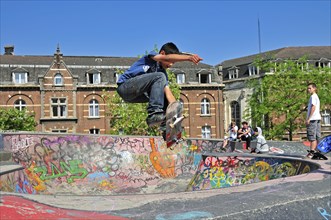 Jumping skateboarder, 12 years old, Indy Grab, skateboard track, Brussels, Belgium, Europe