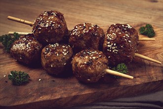 Tsukune, Japanese meatballs, minced chicken, fried on a skewer, with yakitori sauce, homemade, no