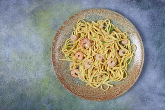 Spaghetti with shrimp, in cream sauce, top view, no people