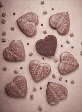 Food wallpaper, chocolate glazed gingerbread, heart-shaped, top view, no people