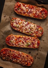 Pizza on a baguette, top view, close-up, no people, fast food, street food