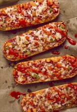 Pizza on a baguette, top view, close-up, no people, fast food, street food