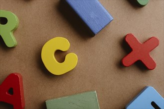 Wooden letters and blocks on a wooden background