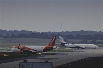 Two aircraft operated by easyjet and SunExpress, photographed at Berlin Brandenburg Airport 'Willy