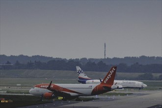 Two aircraft operated by easyjet and SunExpress, photographed at Berlin Brandenburg Airport 'Willy